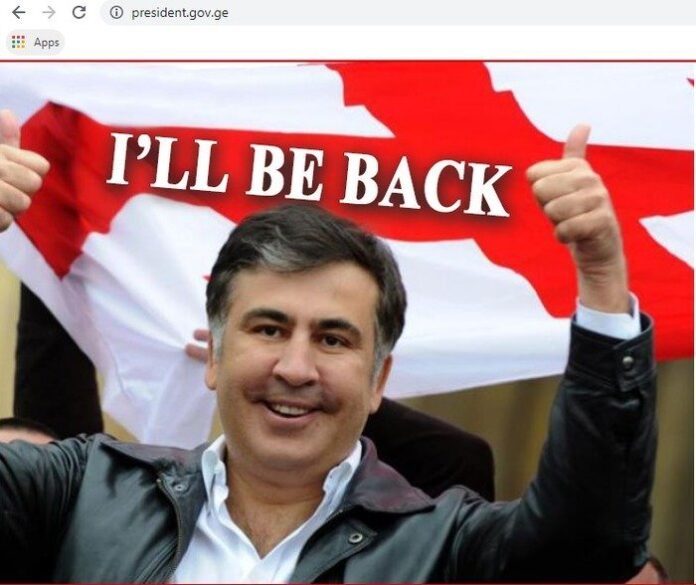 Mixail Saakaşvilinin fotosu və "Mən qayıdacağam" sözləri